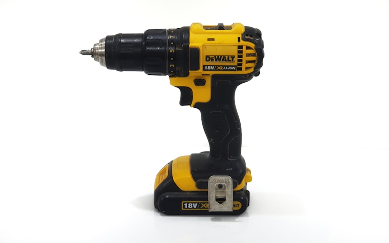 Sparks flying as power tools are used on a job site.